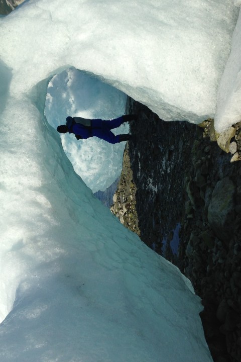 a man walking under ice