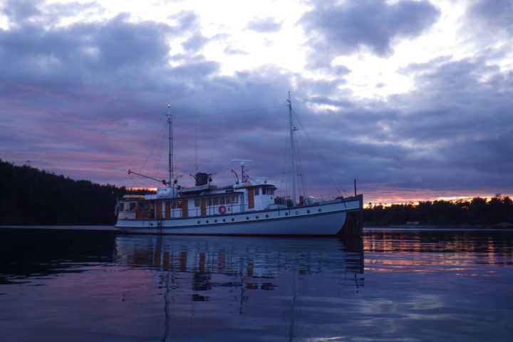 a small boat in a large body of water