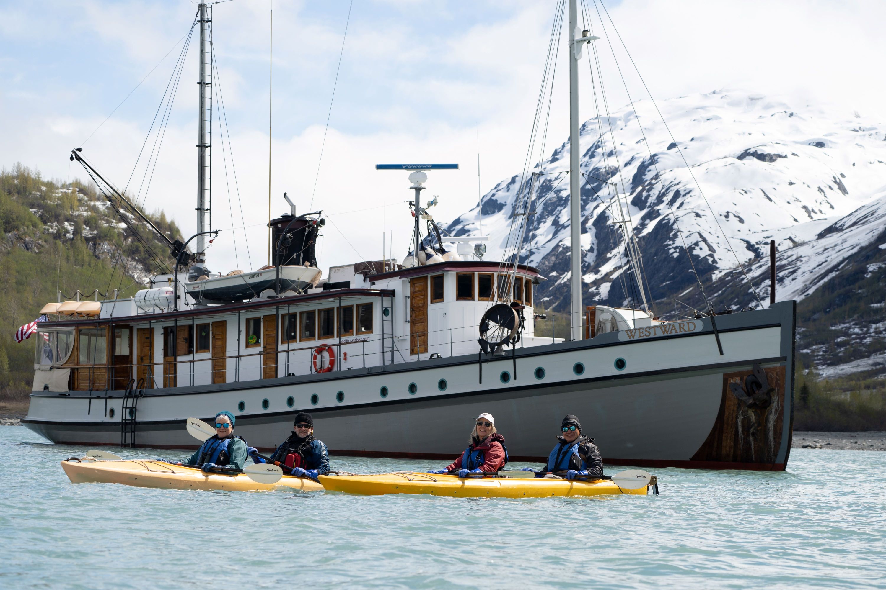 a group of people in a boat on a body of water