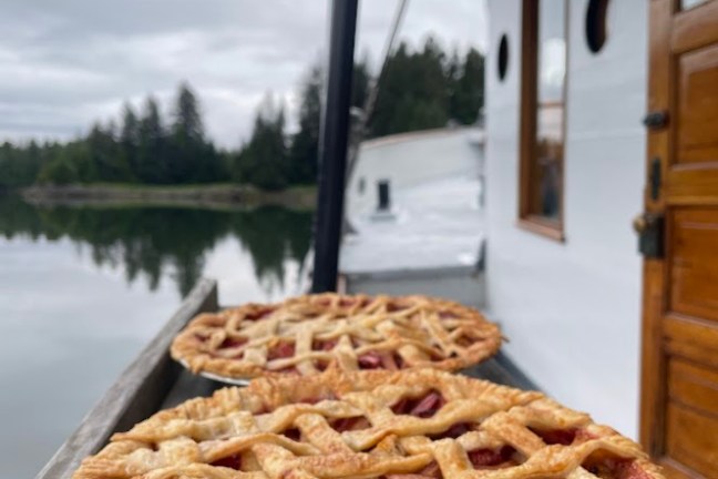 a pizza sitting on top of a wooden table