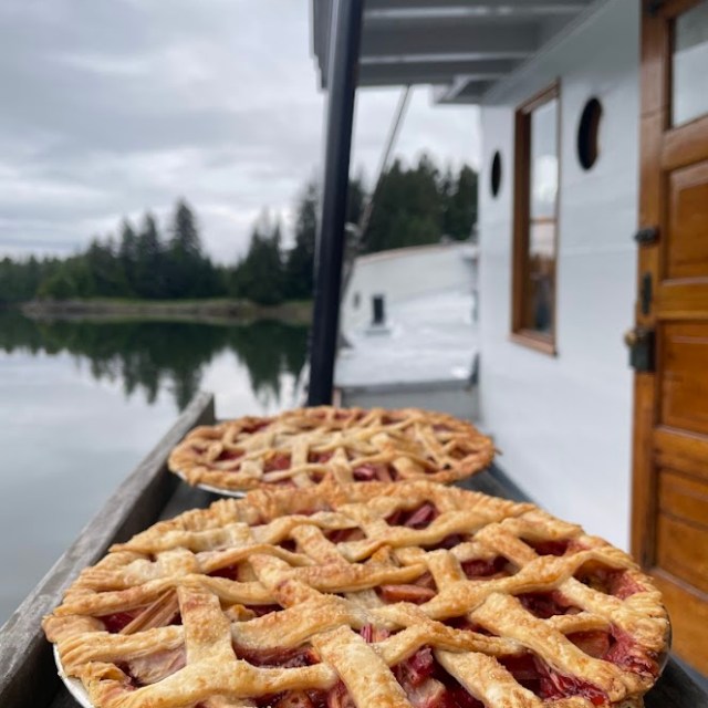 a pizza sitting on top of a wooden table