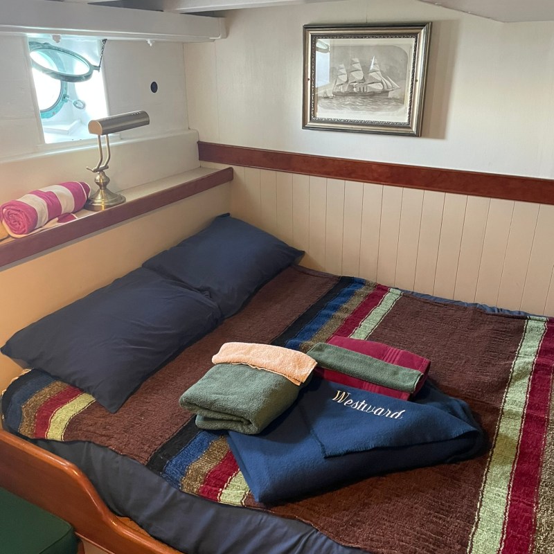 a room with clothes on a bed